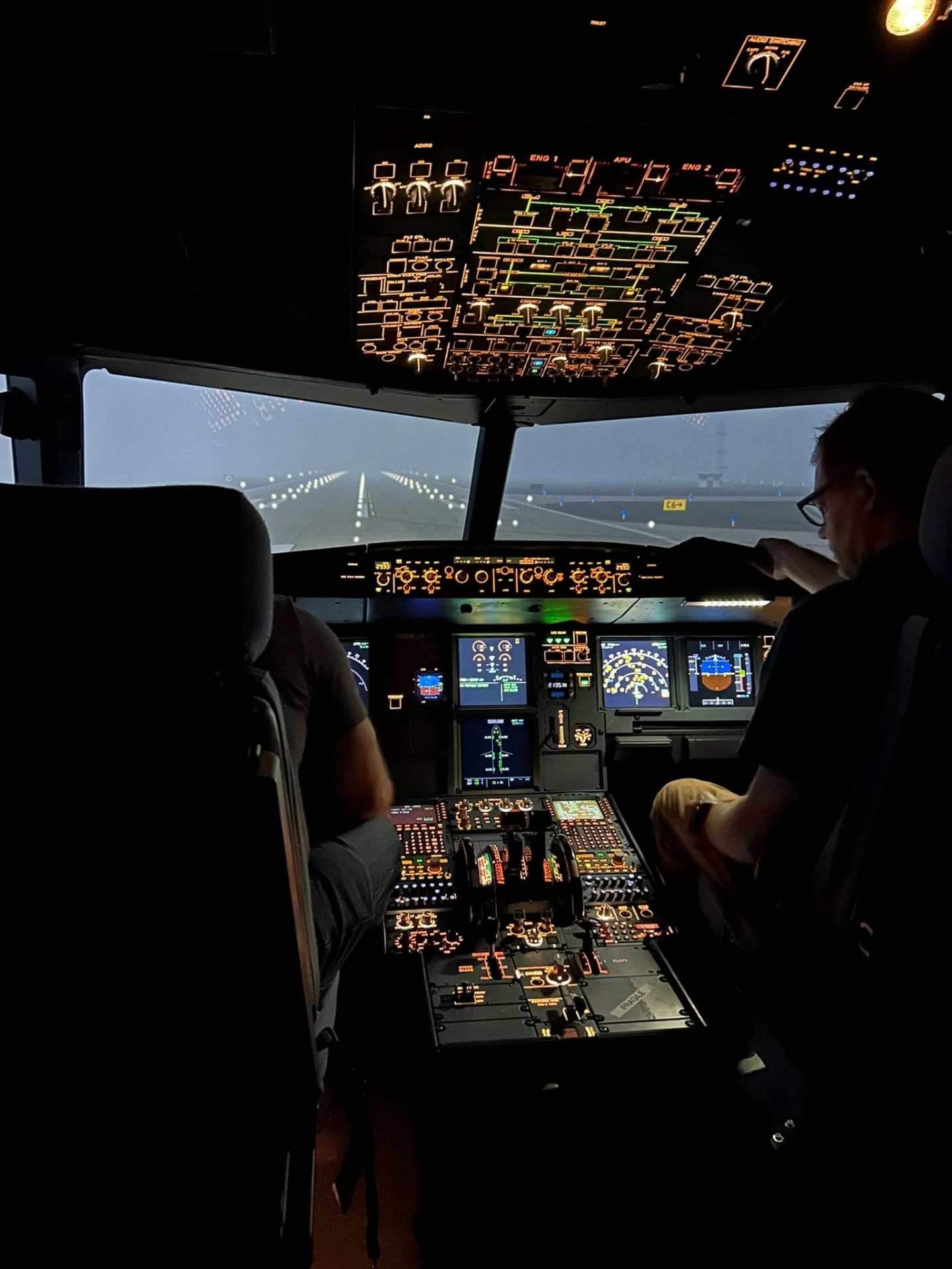 Glowing overhead panels in the simulator at night